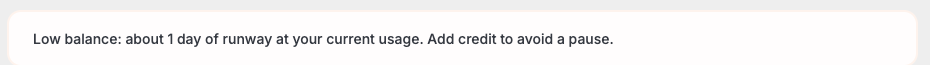 A banner reading "Low balance: about 1 day of runway at your current usage. Add credit to avoid a pause."